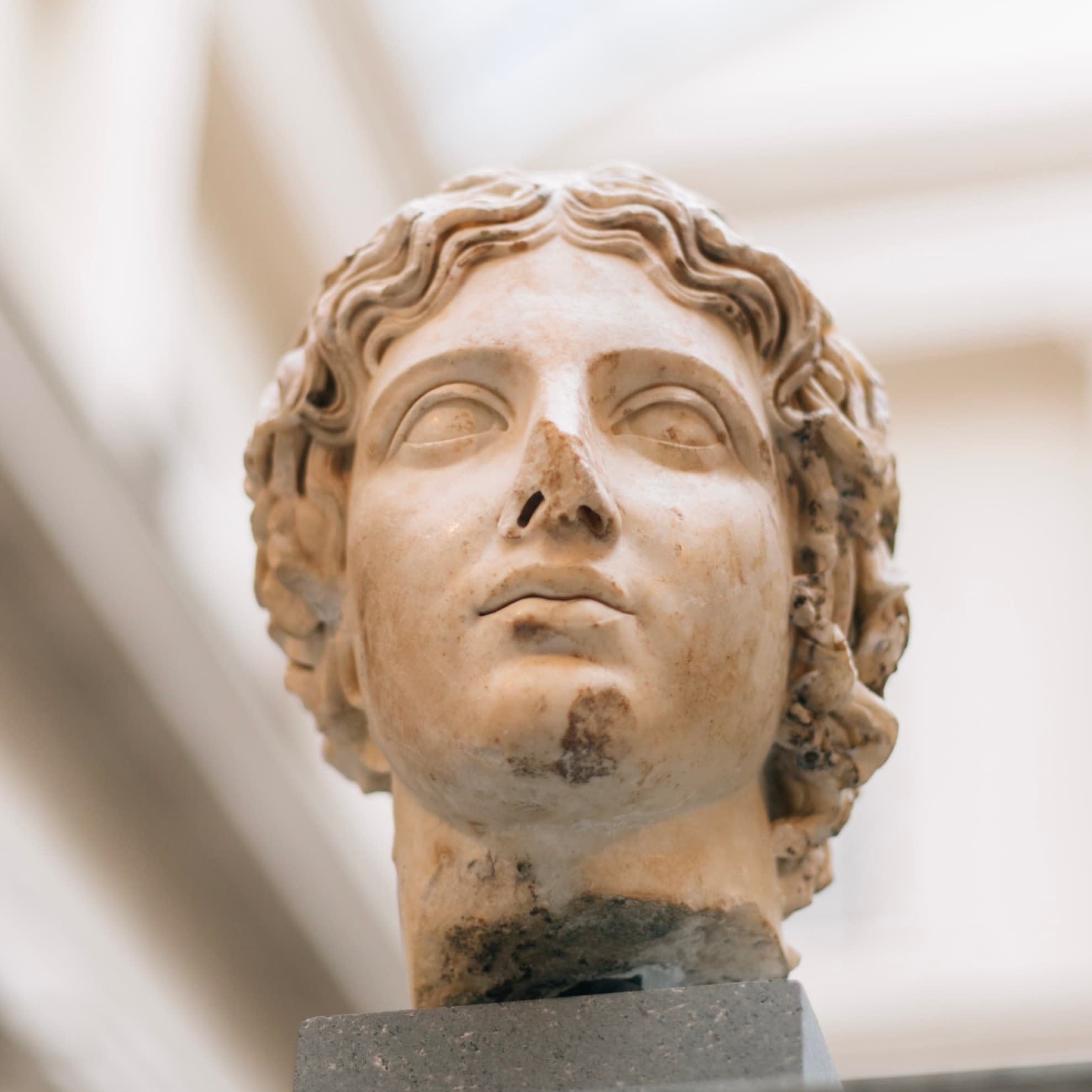 Close-up image of a classical bust with a broken nose, symbolizing the need for revision rhinoplasty. The damaged nose highlights the challenges and considerations in correcting nasal imperfections through surgical revision. This image complements an article discussing the process, benefits, and outcomes of revision rhinoplasty procedures for patients seeking functional and aesthetic improvements.